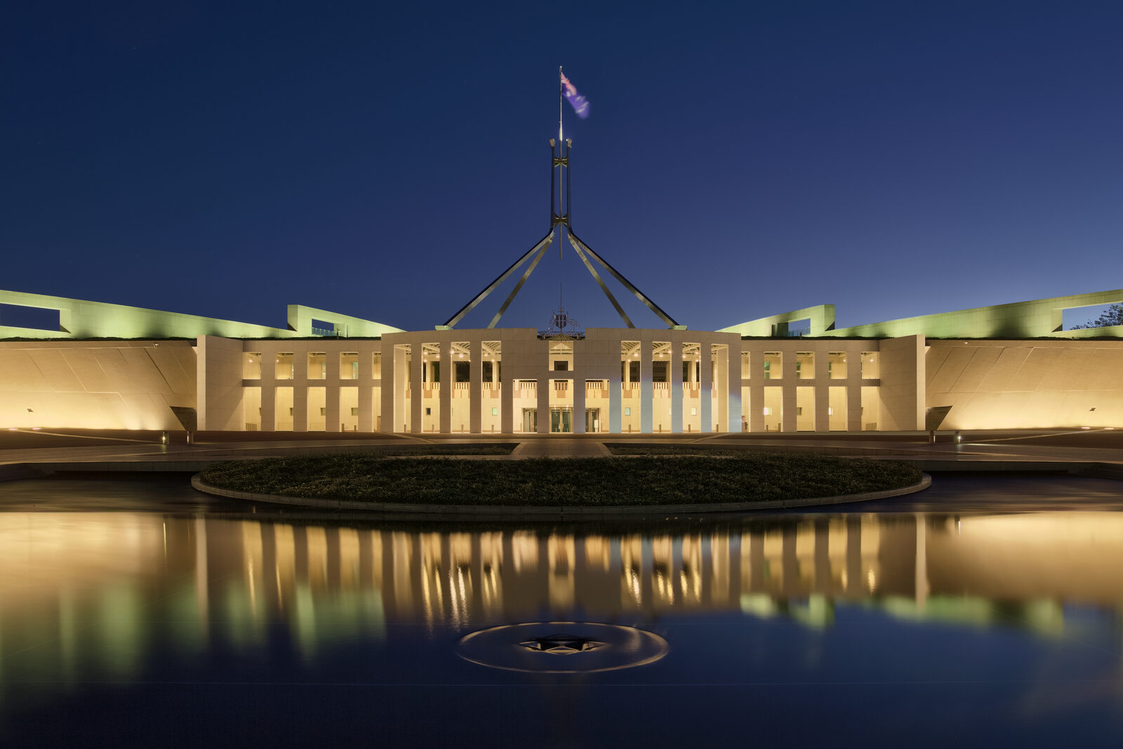 Parliament House, Canberra Parliament House in Canberra at dusk, the stage for Australia's migration policy decisions